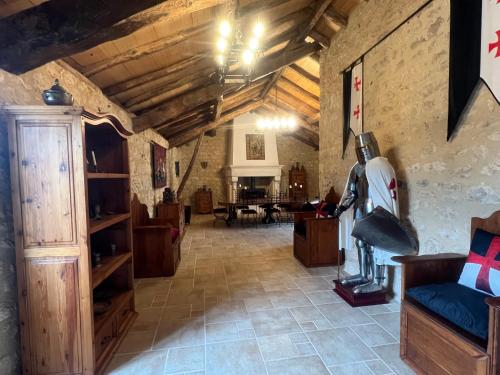 a living room with a couch and a table at Le Relais des Chevaliers "La Chambre des Templiers" in Cordes-sur-Ciel
