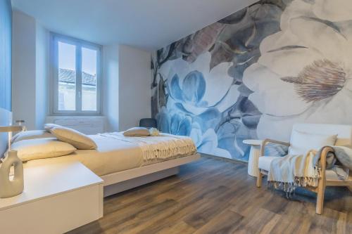 a bedroom with a large mural on the wall at Casa Lenora in Bellano