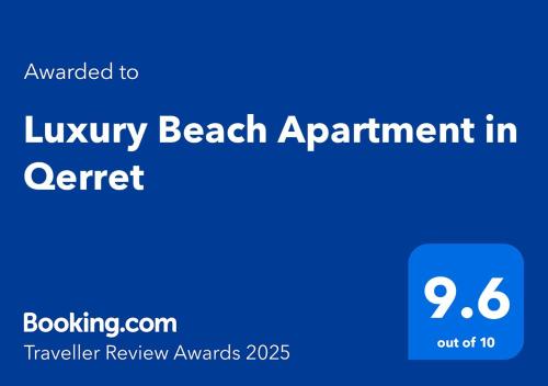 a blue sign with the text luxury beach appointment center at Luxury Beach Apartment in Qerret in Golem