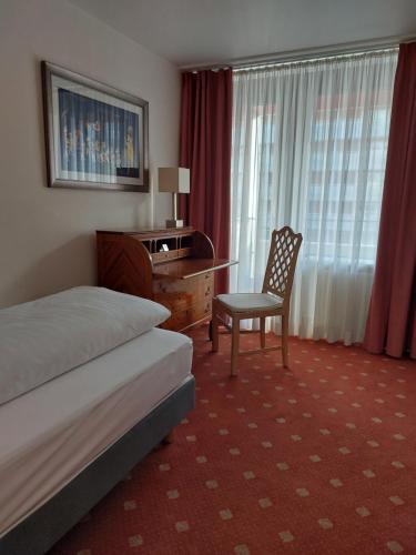 Postel nebo postele na pokoji v ubytování Hotel Wünschmann