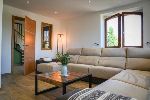 Posezení v ubytování Grande maison de vacances L'Orée des Vignes