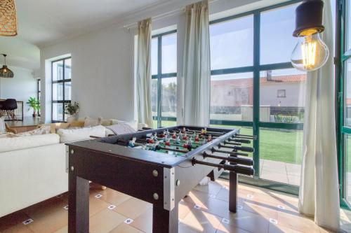 a living room with a foosball table at Casa da Légua in Moledo