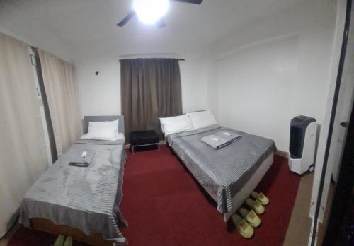 Postel nebo postele na pokoji v ubytování Js Guest House