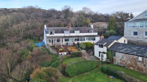 an aerial view of a large white house at A View With A Room in Penrhyn Bay