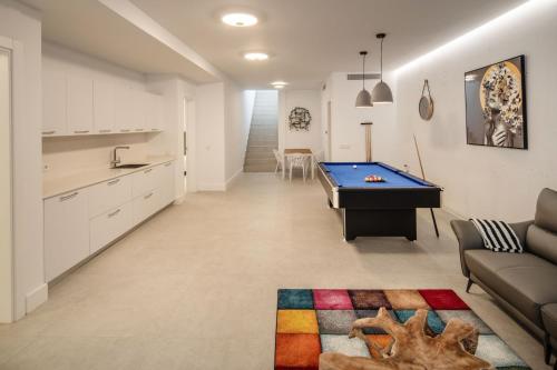 a living room with a pool table in it at ODIN VILLAS by Buenavilla in Puerto Calero