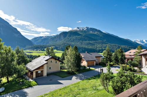 an aerial view of a home with mountains in the background at Chesa Panorama B - La Punt in La Punt-Chamues-ch