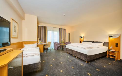 Postel nebo postele na pokoji v ubytování Hotel Theresientor