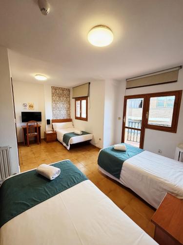 Katil atau katil-katil dalam bilik di Hostal Legaz