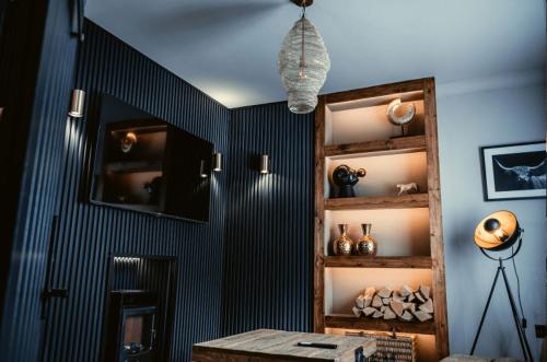 a room with a black and white wall with a shelf at Derwent Manor Boutique Hotel in Consett