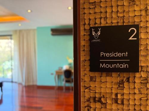 a sign on a wall in a room at The Height Khaoyai Resort in Ban Huai Sok Noi