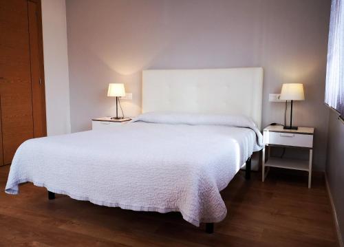 Postel nebo postele na pokoji v ubytování Apartamentos Ronda Luz