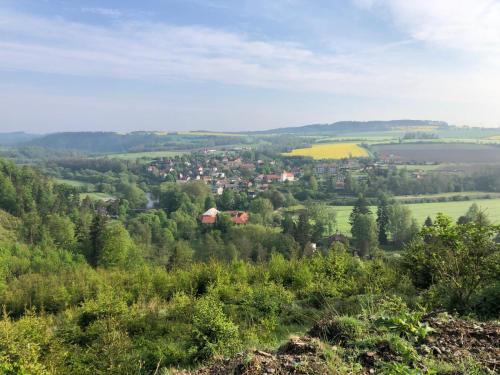 a view of a small town in the hills at Hostinec U PUDILŮ in Soběšín