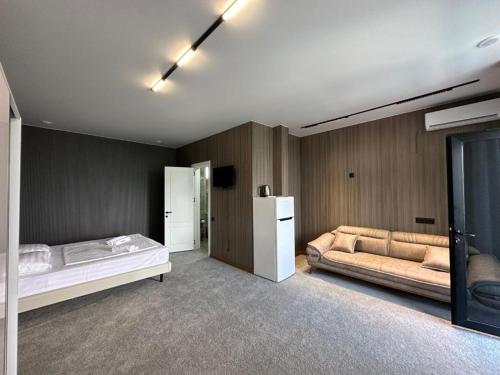 Rúm í herbergi á Elite Hotel Kobuleti
