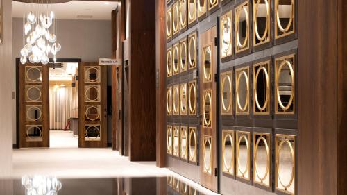 a room with a wall with a bunch of wine bottles at Doubletree By Hilton Kars Sarikamis in Sarıkamıs