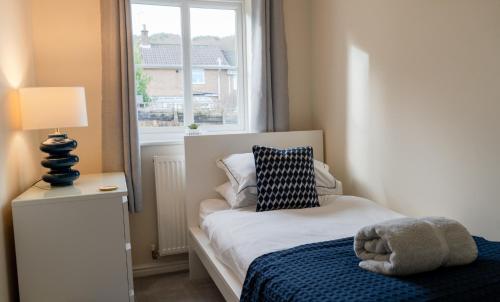 Una cama o camas en una habitación de Progress Grove