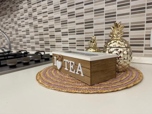 a wooden box sitting on top of a table with a pineapple at Palazzo Monterone Apartments in Spoleto