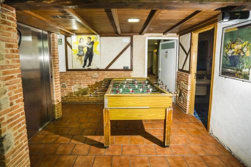 a room with a table in the middle of a room at La Chirumba in Aldeatejada