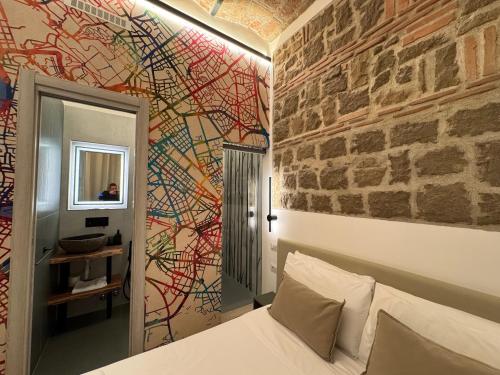 Una televisión o centro de entretenimiento en Hotel Felice