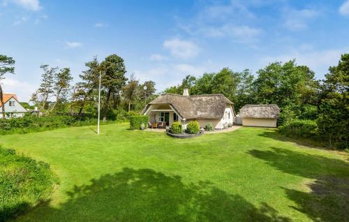 an image of a house with a large yard at Nice Home In Blåvand With Kitchen in Blåvand