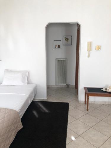 Postel nebo postele na pokoji v ubytování Eleni's Meteora