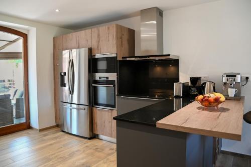 Dapur atau dapur kecil di Grande maison de vacances L'Orée des Vignes