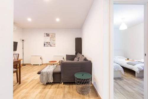 Ένα ή περισσότερα κρεβάτια σε δωμάτιο στο Josep Tarradellas Entire Apartment