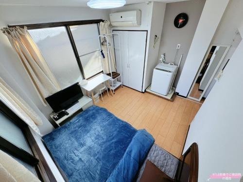 Postel nebo postele na pokoji v ubytování Kawaguchi house