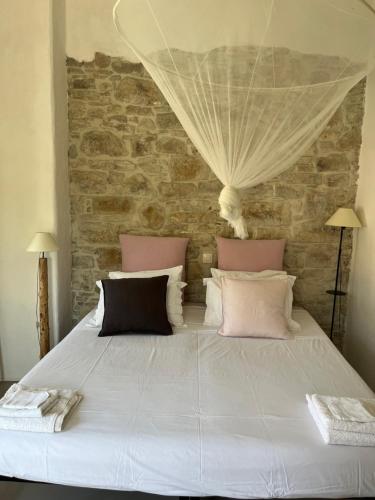 Posteľ alebo postele v izbe v ubytovaní Garden Village House in Pythagorio-Hora, Samos Island
