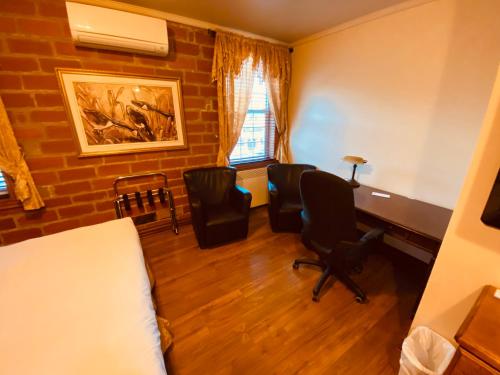 Coin salon dans l'établissement Le Grand Hôtel