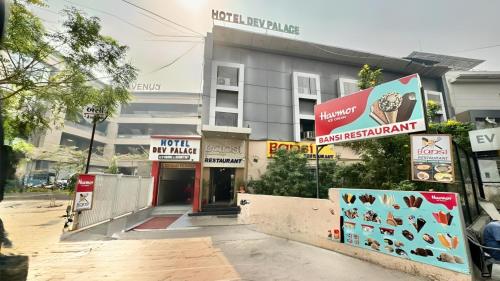 a building with signs in front of it at Hotel Dev Palace in Ahmedabad