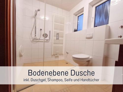 a white bathroom with a shower and a toilet at Germersheimer Rhein-Idylle Sauna, Whirlpool in Germersheim