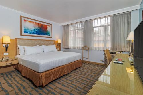 Postel nebo postele na pokoji v ubytování Grand Hotel Guayaquil, Ascend Hotel Collection