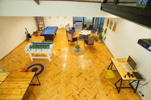 an overhead view of a living room with a table and chairs at Joyau secret # Jardin # Piscine # Bien-être # prox centre ville in Antananarivo