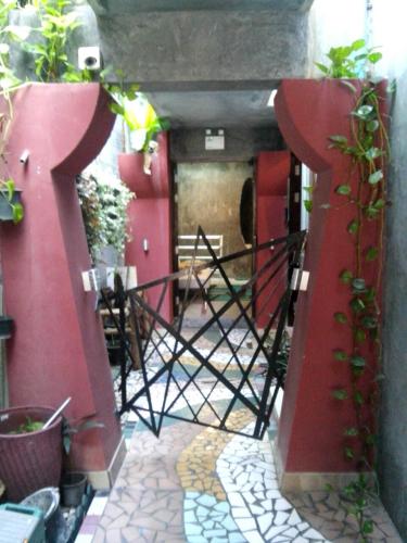 an entrance to a building with a gate with the letter t at Phuket Paradiso in Chalong 
