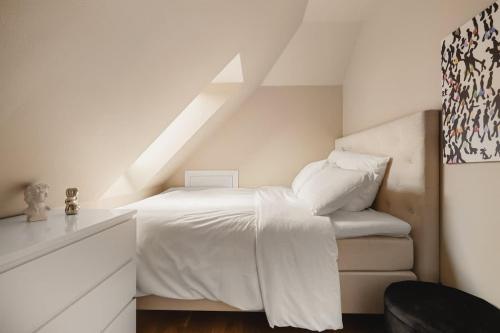 Ένα ή περισσότερα κρεβάτια σε δωμάτιο στο Dinbnb Apartments Bryggen
