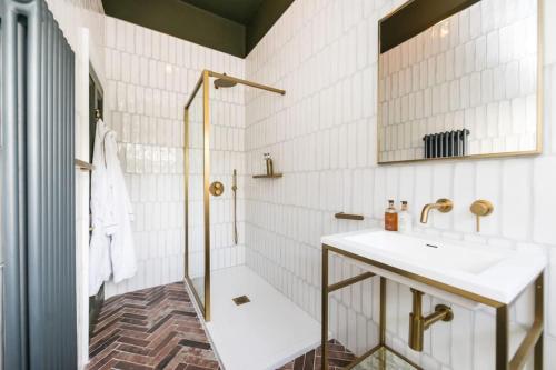 a bathroom with a sink and a shower at Hillthorpe Estate - 14 Bed Manor House with Hot Tubs and Secluded Gardens in East Hardwick