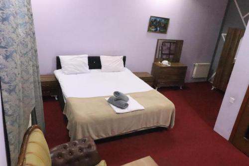 Postel nebo postele na pokoji v ubytování Ekm Hotel