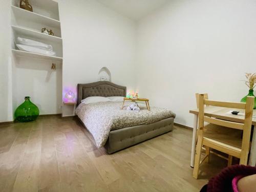 Postel nebo postele na pokoji v ubytování Vecchia Bari Apartments