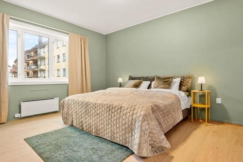 Ένα ή περισσότερα κρεβάτια σε δωμάτιο στο Dinbnb Apartments l Free Parking l 5 Min From Torget l Nearby Coast I Newly Furnished