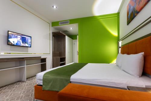 Postel nebo postele na pokoji v ubytování ALBA HOTEL & SPA