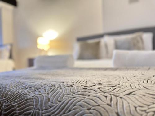 a close up of a bed in a room at SHM Stays Solihull HS2 NEC Airport Nr M6 M40 M42 Great for Long & Short stays 15 min walk to Train Station 5 min drive to Town Centre outside Bus Stops & Supermarket Free Parking in Solihull