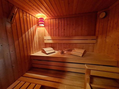 a sauna with a sink and a light in it at Chalet Ski in by Globalimmoservice in Bad Kleinkirchheim