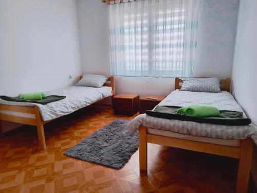 Postel nebo postele na pokoji v ubytování Apartman Mina