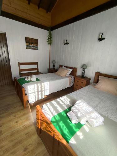 Postel nebo postele na pokoji v ubytování Casal do Vulcão