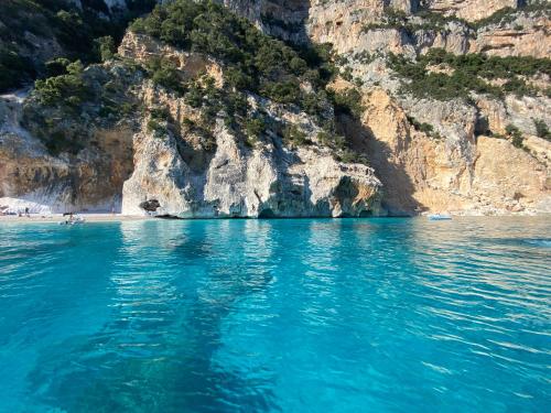 a large body of water with a rocky coastline at Villa Federica by Etra Vacanze in Orosei