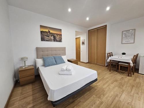 En eller flere senge i et værelse på Magico estudio en Plaza España