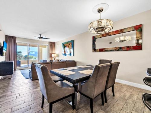 a dining room with a table and chairs at Ariel Dunes 209 in Coffeyville