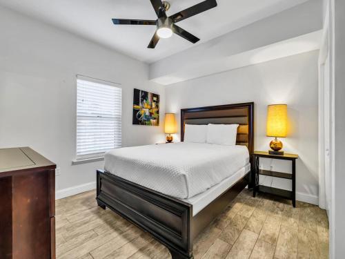 a bedroom with a bed and a ceiling fan at Ariel Dunes 209 in Coffeyville