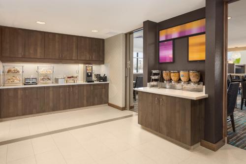 a lobby of a restaurant with a counter with food at Residence Inn by Marriott Shreveport-Bossier City/Downtown in Bossier City