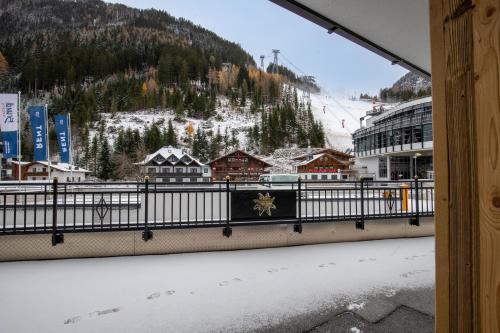 a view of a snow covered mountain from a balcony at Hotel Garni Monte Bianco in Ischgl